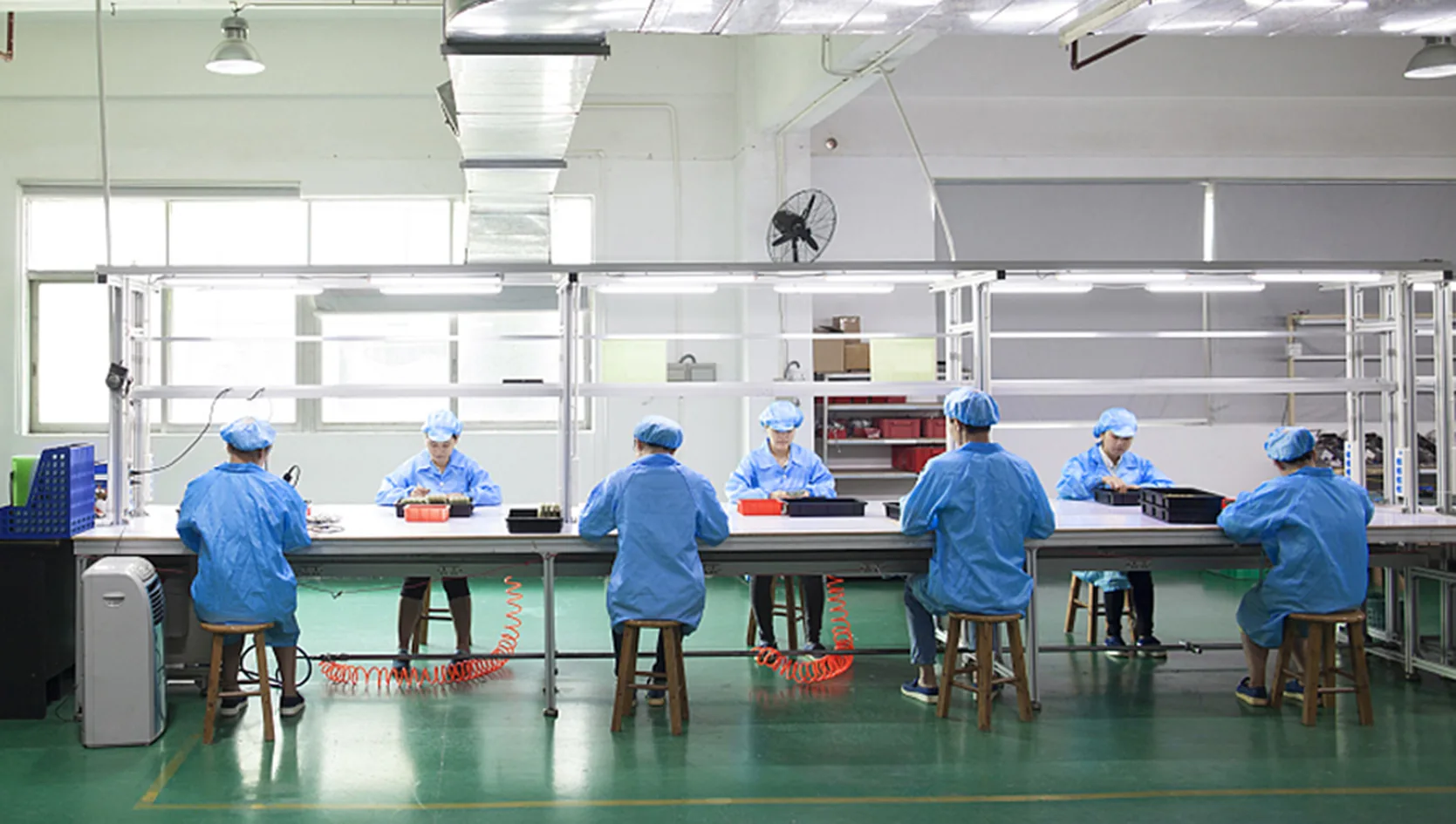 YARMEE manufacturing facility β workers at production line